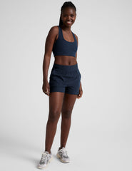 blue mid-rise spacedye shorts with pockets.