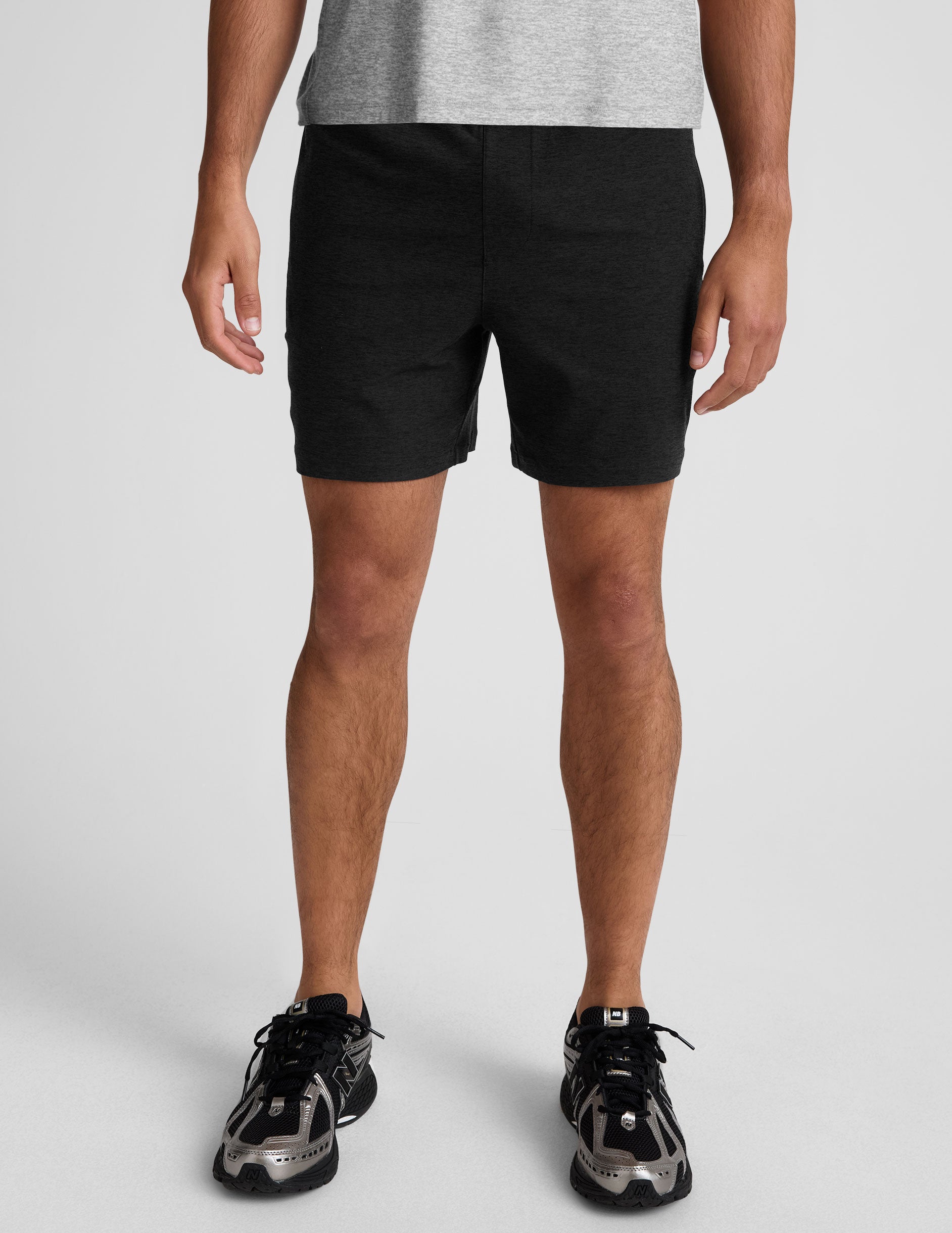 black men's spacedye shorts against a plain background.