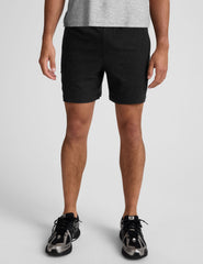 black men's spacedye shorts against a plain background.