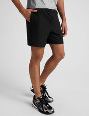 black men's spacedye shorts against a plain background.