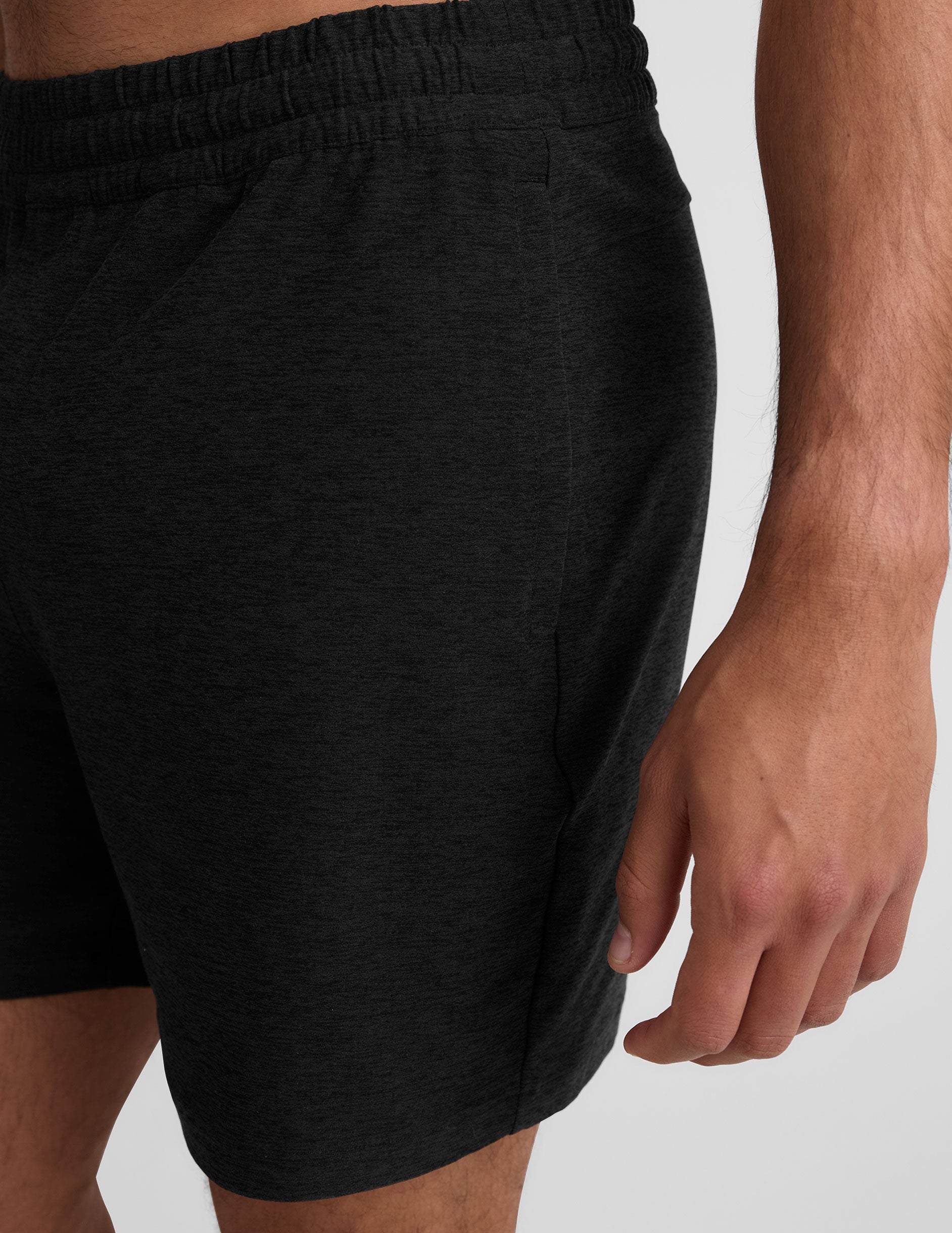 black men's spacedye shorts against a plain background.