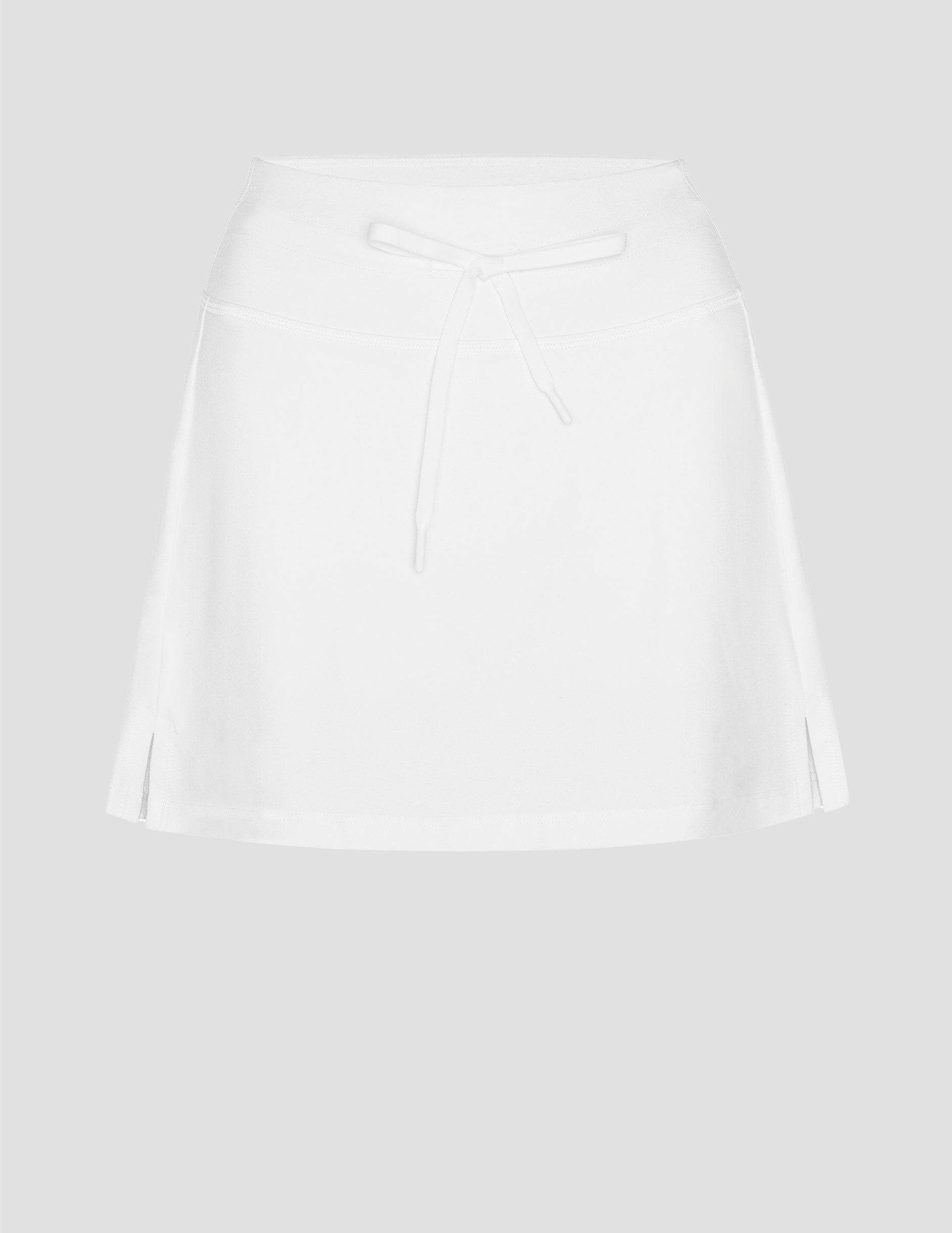 white mini skirt with a drawstring at waistband and built in shorts with pockets.