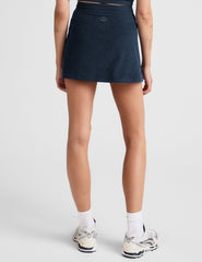 blue mini active skirt with a drawstring at waistband and built in shorts with pockets.