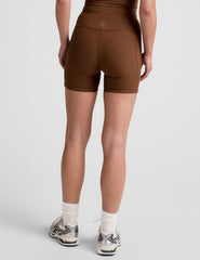 brown high-waisted 5" inseam biker shorts with a drawstring at waistband and side pockets. 