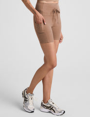 brown high-waisted 5" inseam biker shorts with pockets and a drawstring at waistband. 
