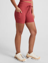 red high-waisted 5" inseam biker shorts with a drawstring at waistband and side pockets. 