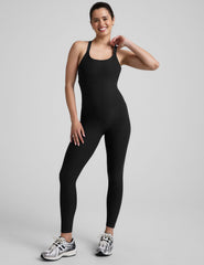 black midi length jumpsuit with cross straps on back.