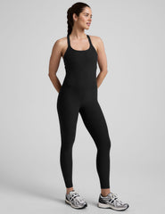 black midi length jumpsuit with cross straps on back.