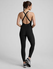 black midi length jumpsuit with cross straps on back.