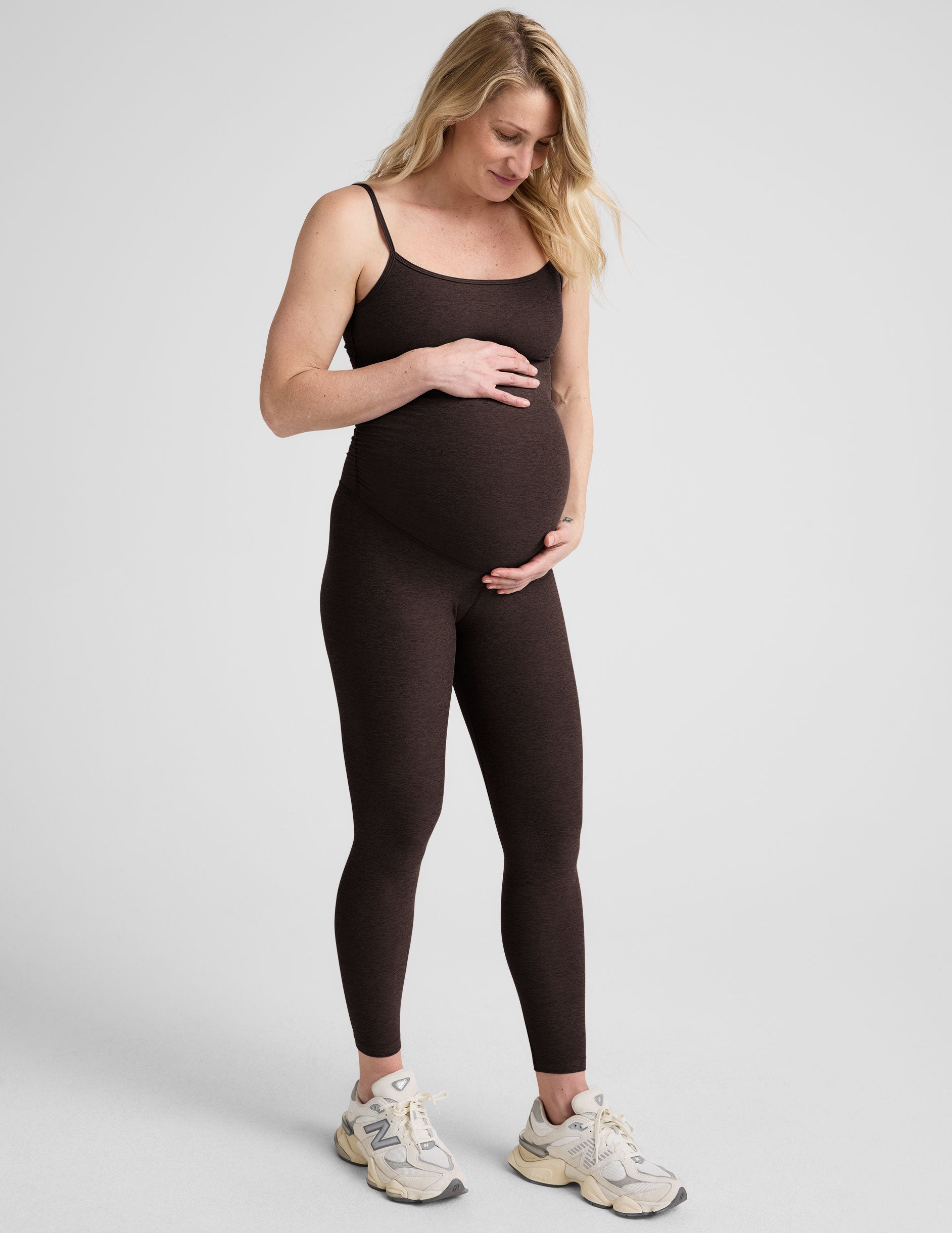 brown maternity midi length tank jumpsuit with adjustable straps.