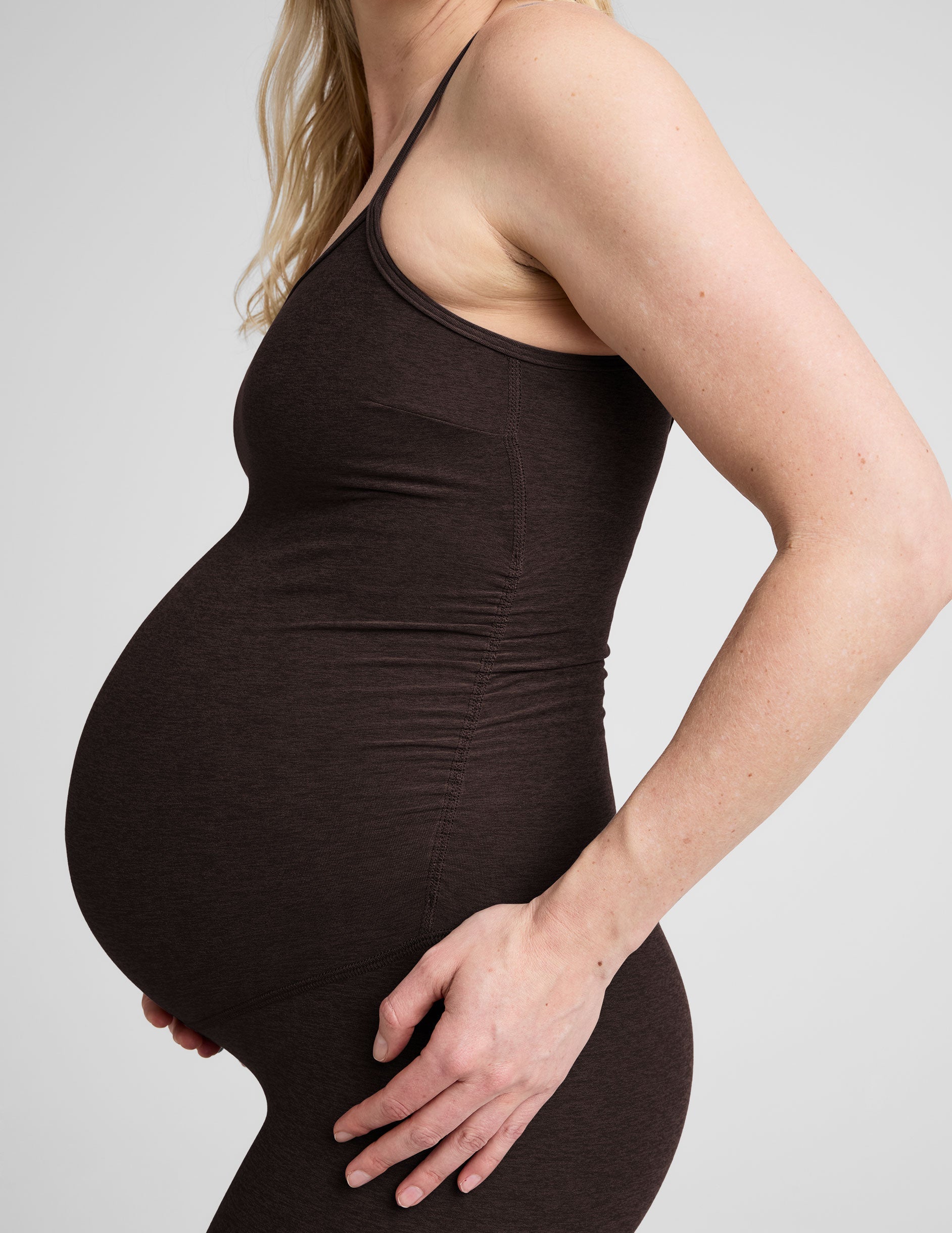 brown maternity midi length tank jumpsuit with adjustable straps.