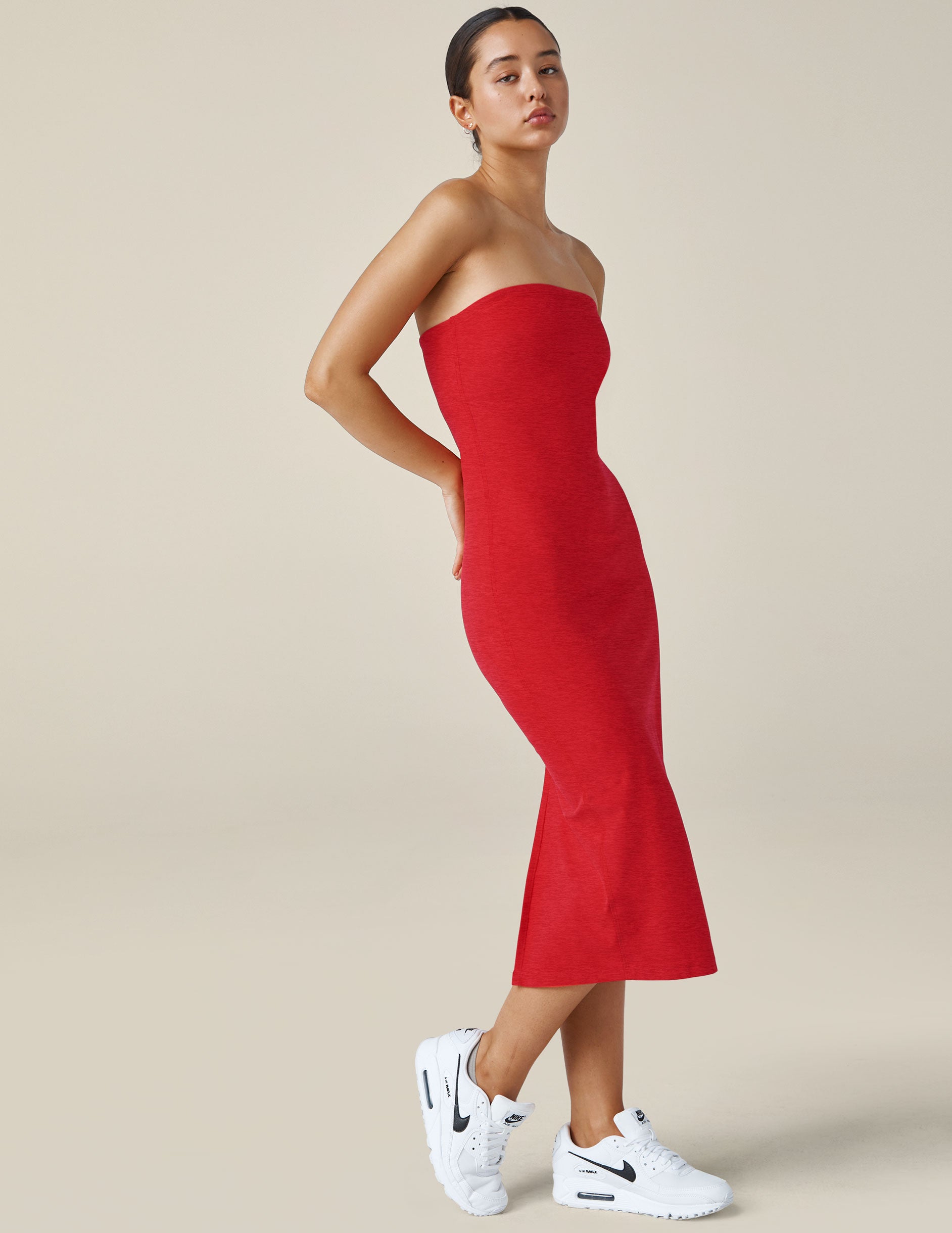 red strapless midi length dress.