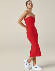 red strapless midi length dress.