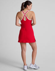red mini dress with white trim and a back crossover strap detail.