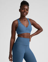 blue v-neck racerback bra with remove-able pads.