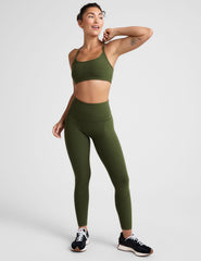 green racerback bra with thin straps.