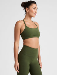 green racerback bra with thin straps.