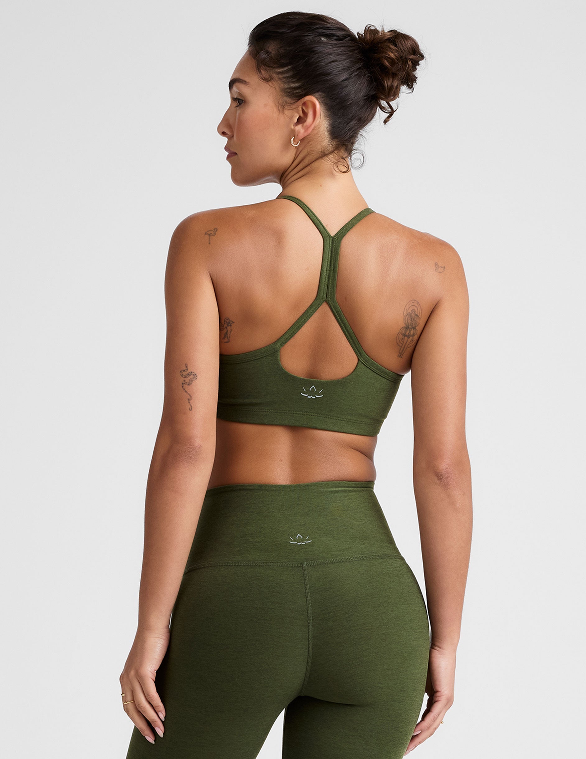 green racerback bra with thin straps.