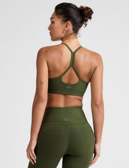 green racerback bra with thin straps.