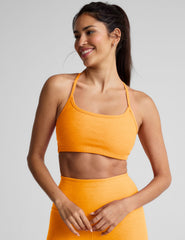 orange racerback bra with slim straps.