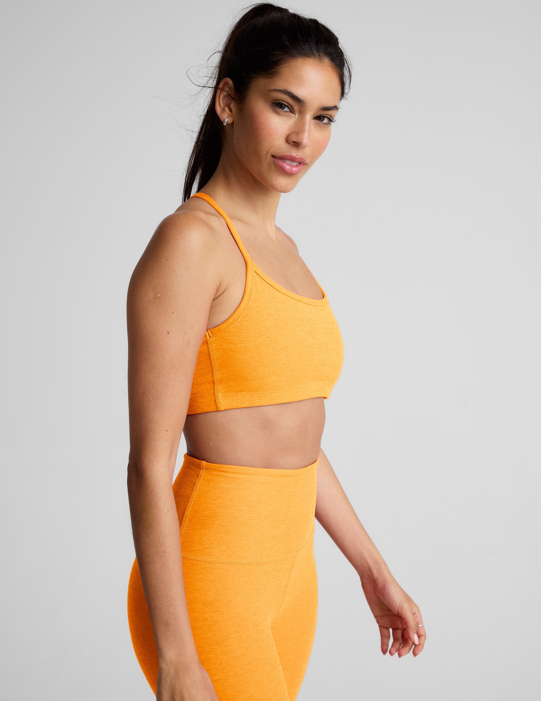 orange racerback bra with slim straps.