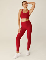 red scoop neck bra top with a twist strap detail in back.