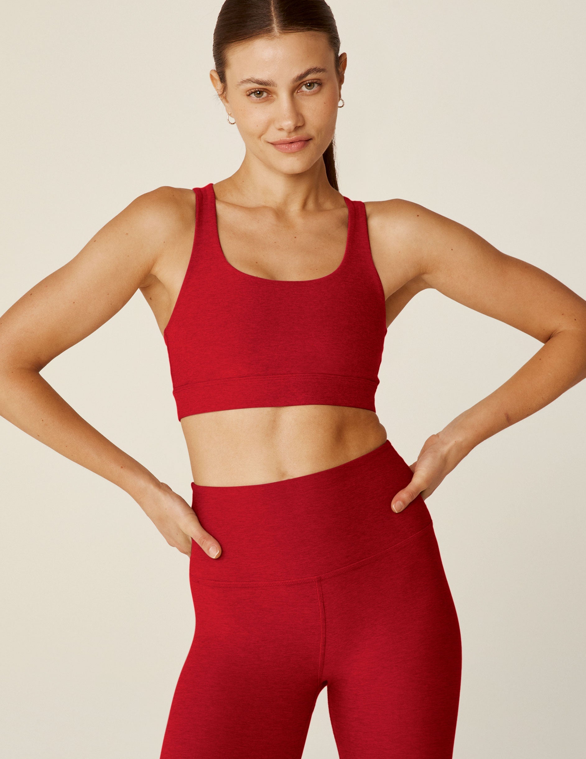 red scoop neck bra top with a twist strap detail in back.