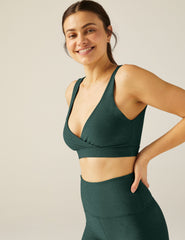 green bra top with a crossover design in front