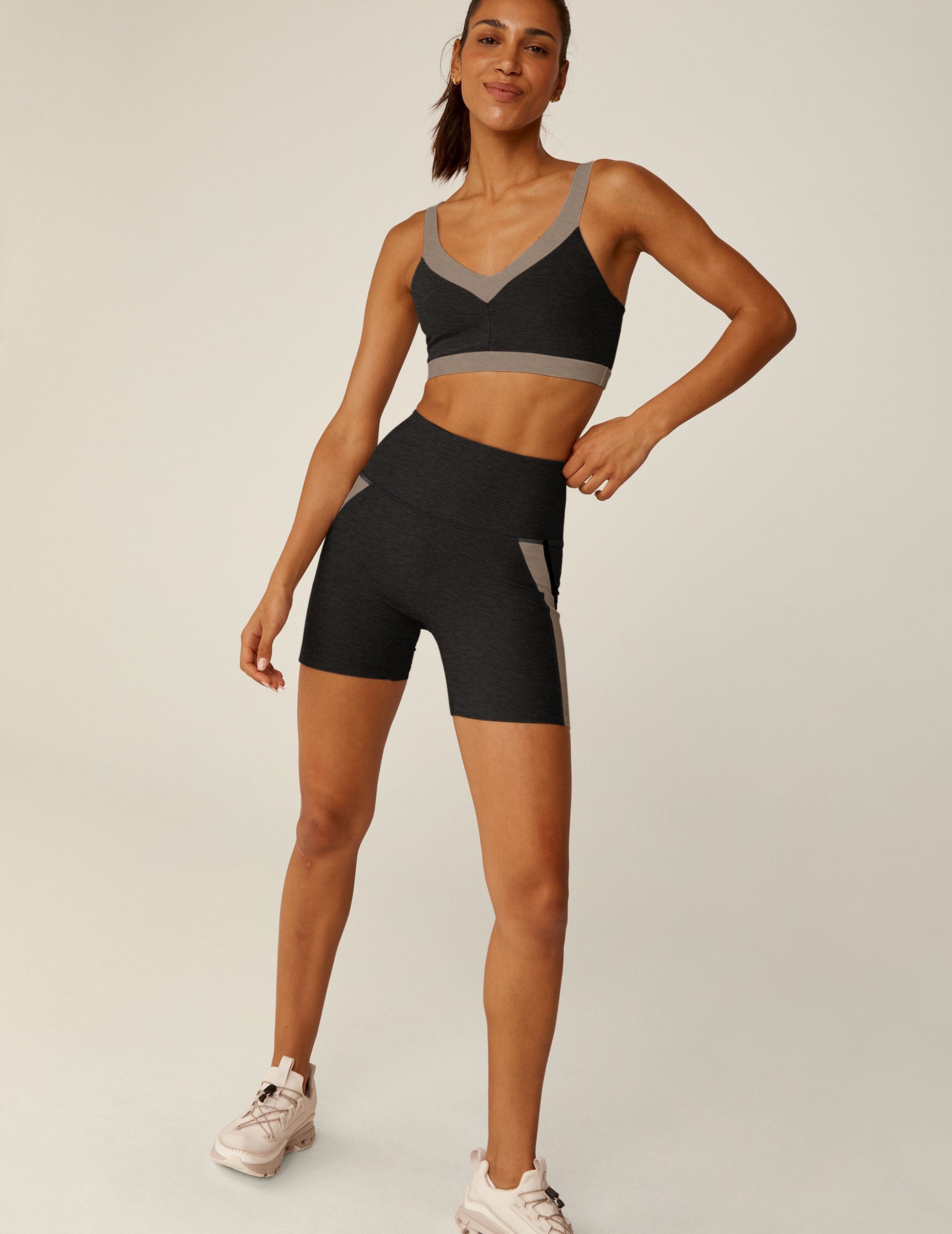 black v-neck bra top with brown outlining details.