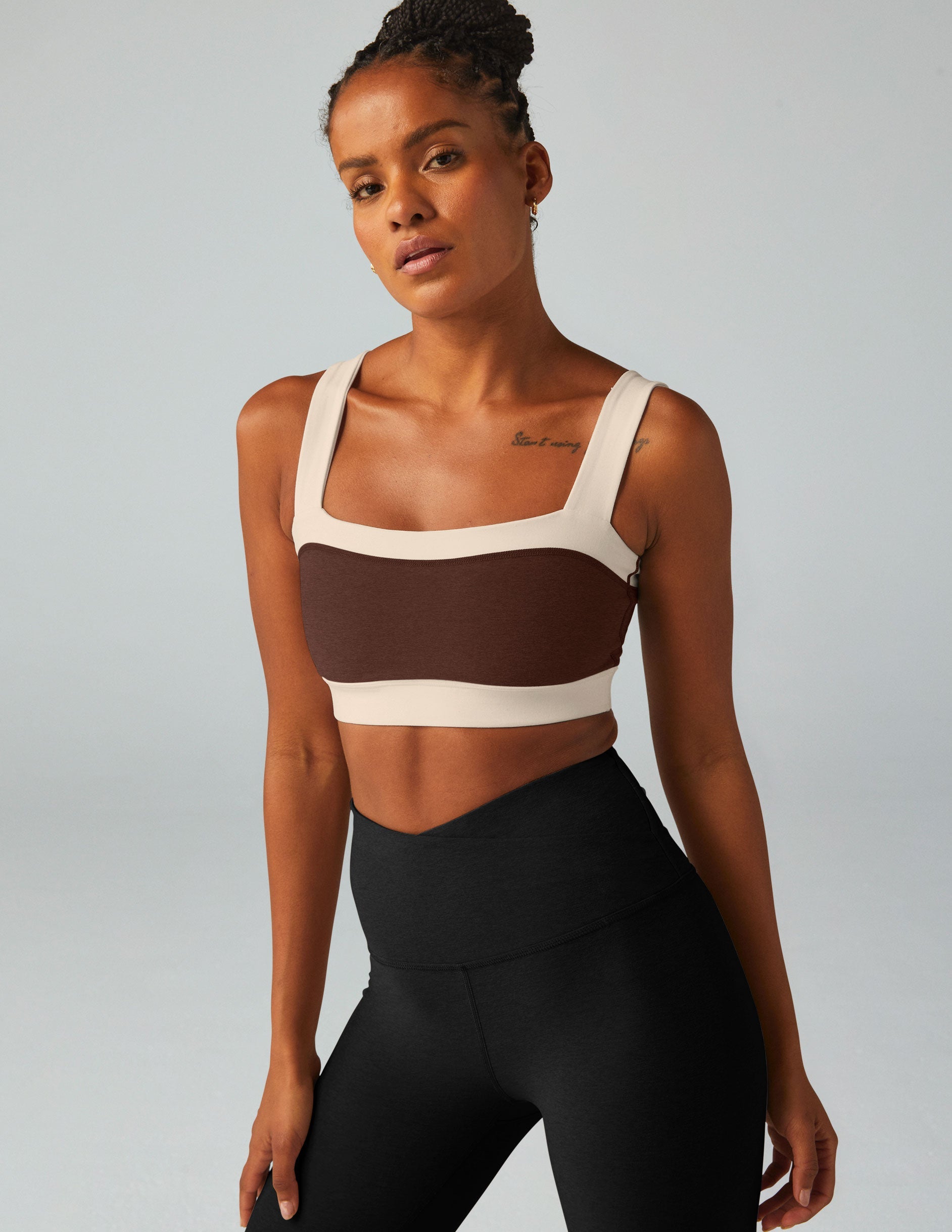 brown square neck bra top with white outlining.