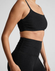 black slim racerback bra with shirred detailing on the sides.