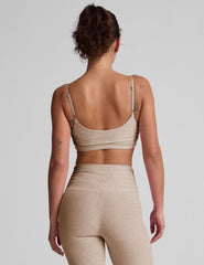 brown bra with shirred detailing on the sides and adjustable straps.