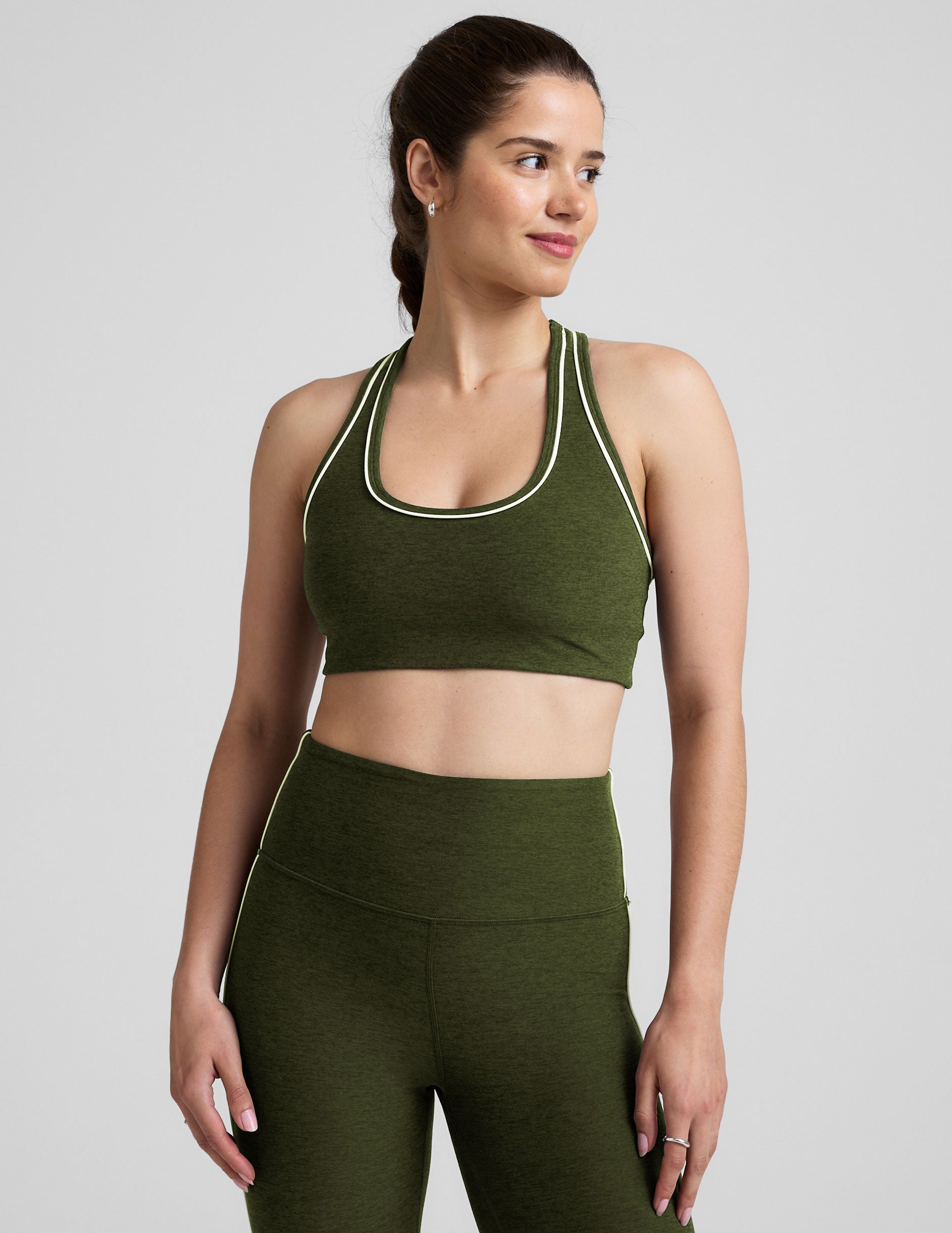 green racerback bra with white contrast trim.