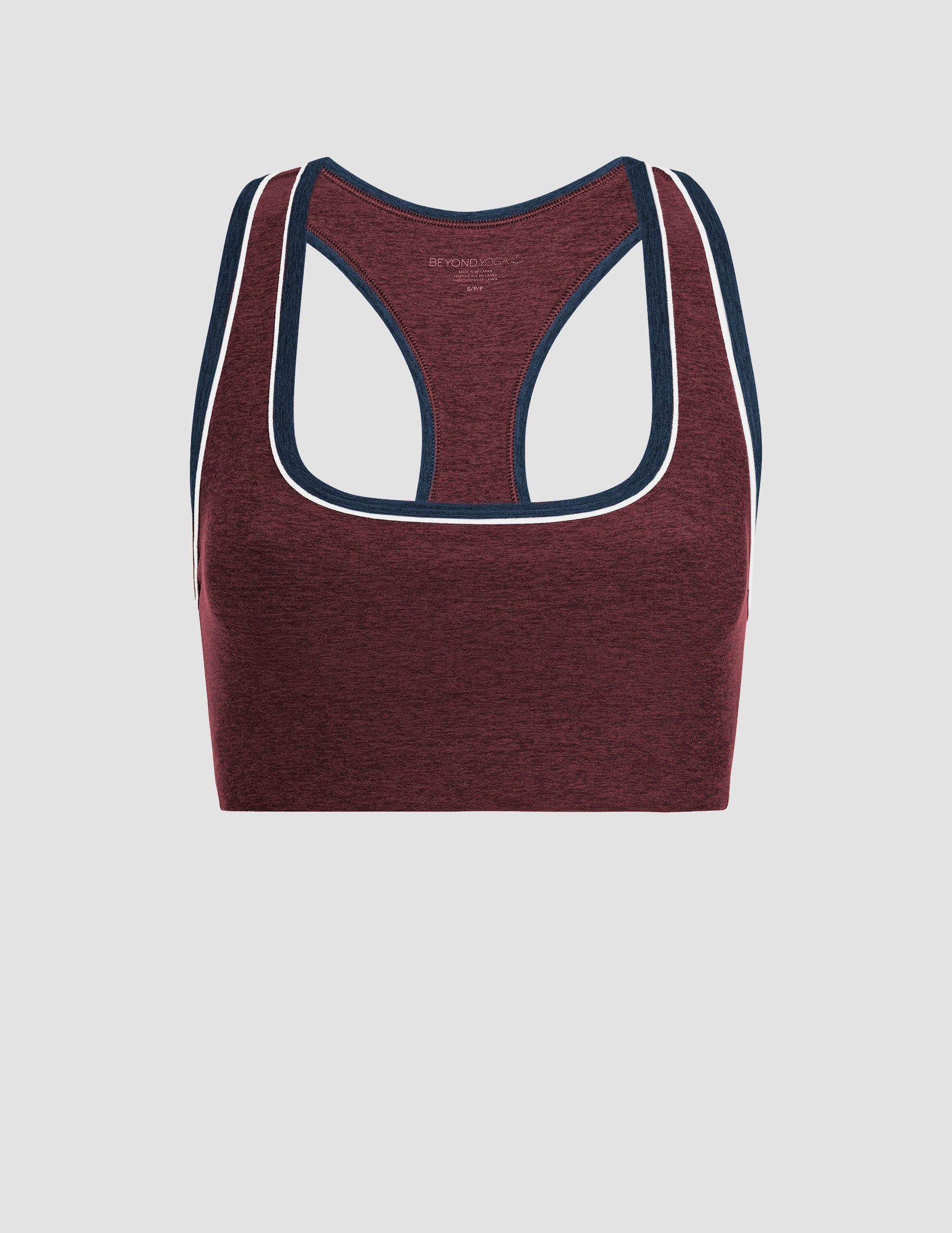 maroon sports bra with navy accents and white contrast trim on a light gray background.