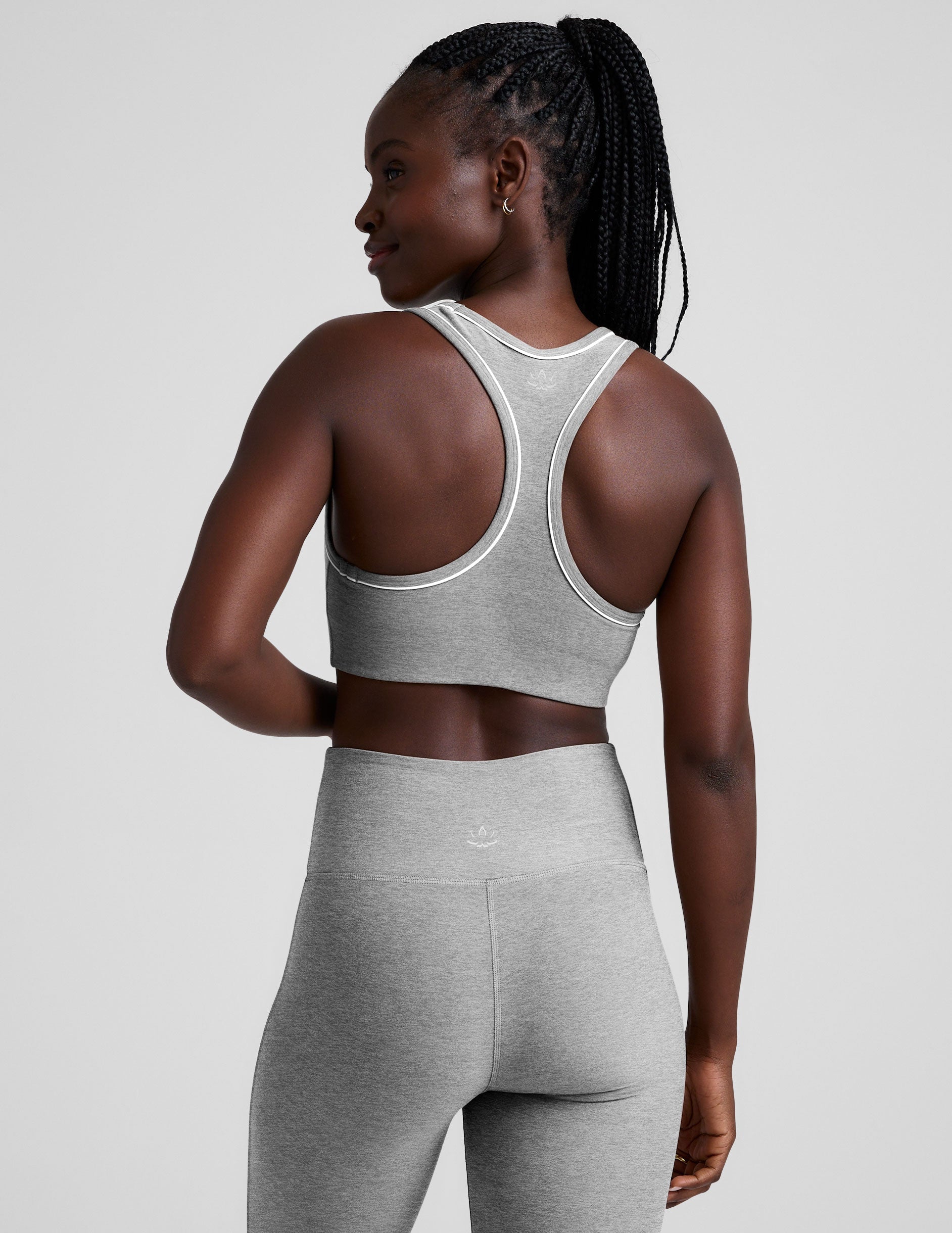 grey scoop neck racerback bra with white contrast trim.