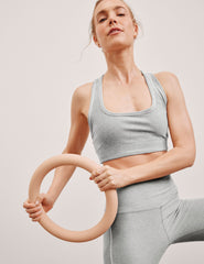 grey scoop neck racerback bra with white contrast trim.