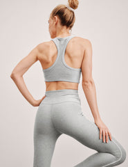 grey scoop neck racerback bra with white contrast trim.