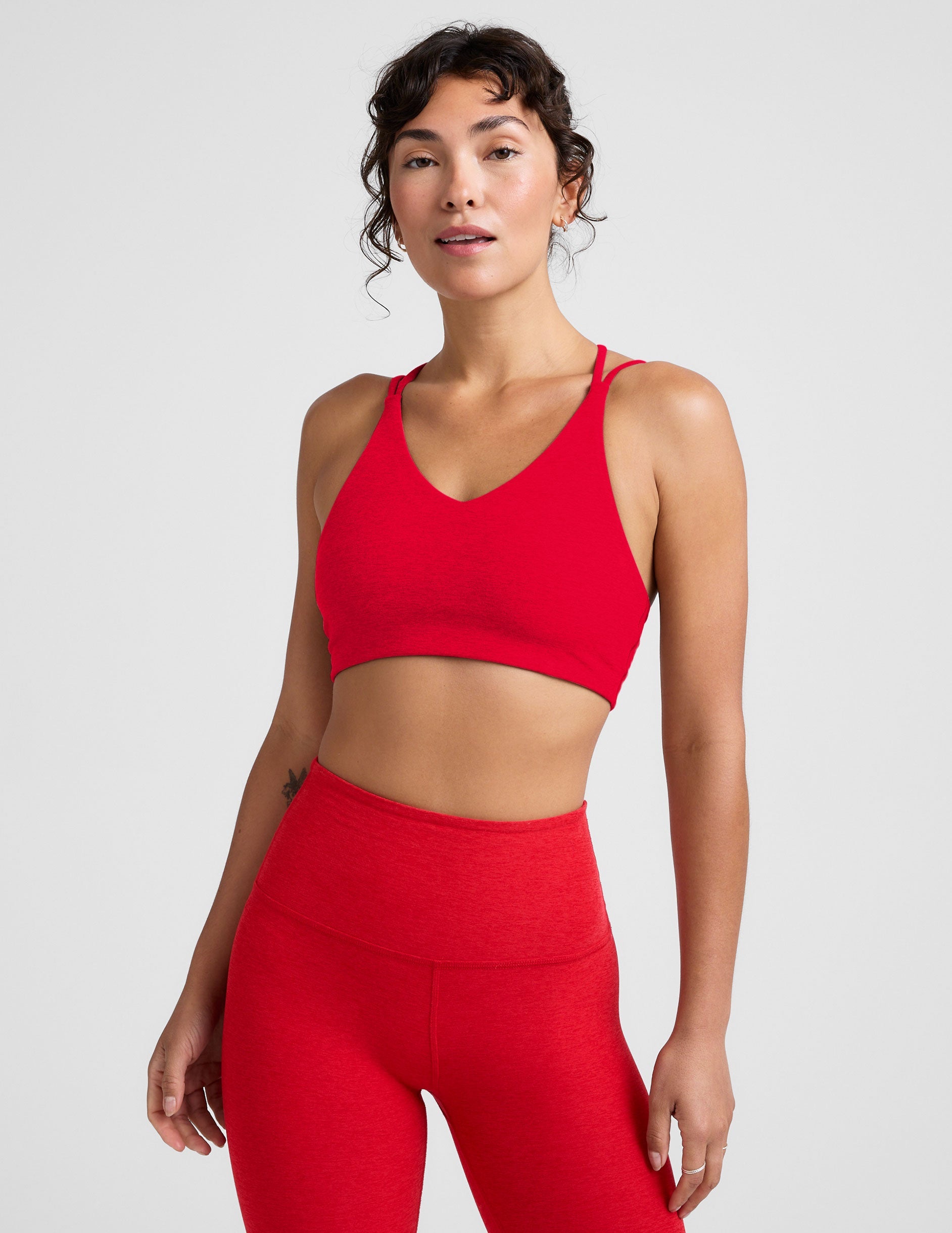 red v-neck bra top with crossover straps in the back.