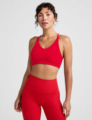 red v-neck bra top with crossover straps in the back.