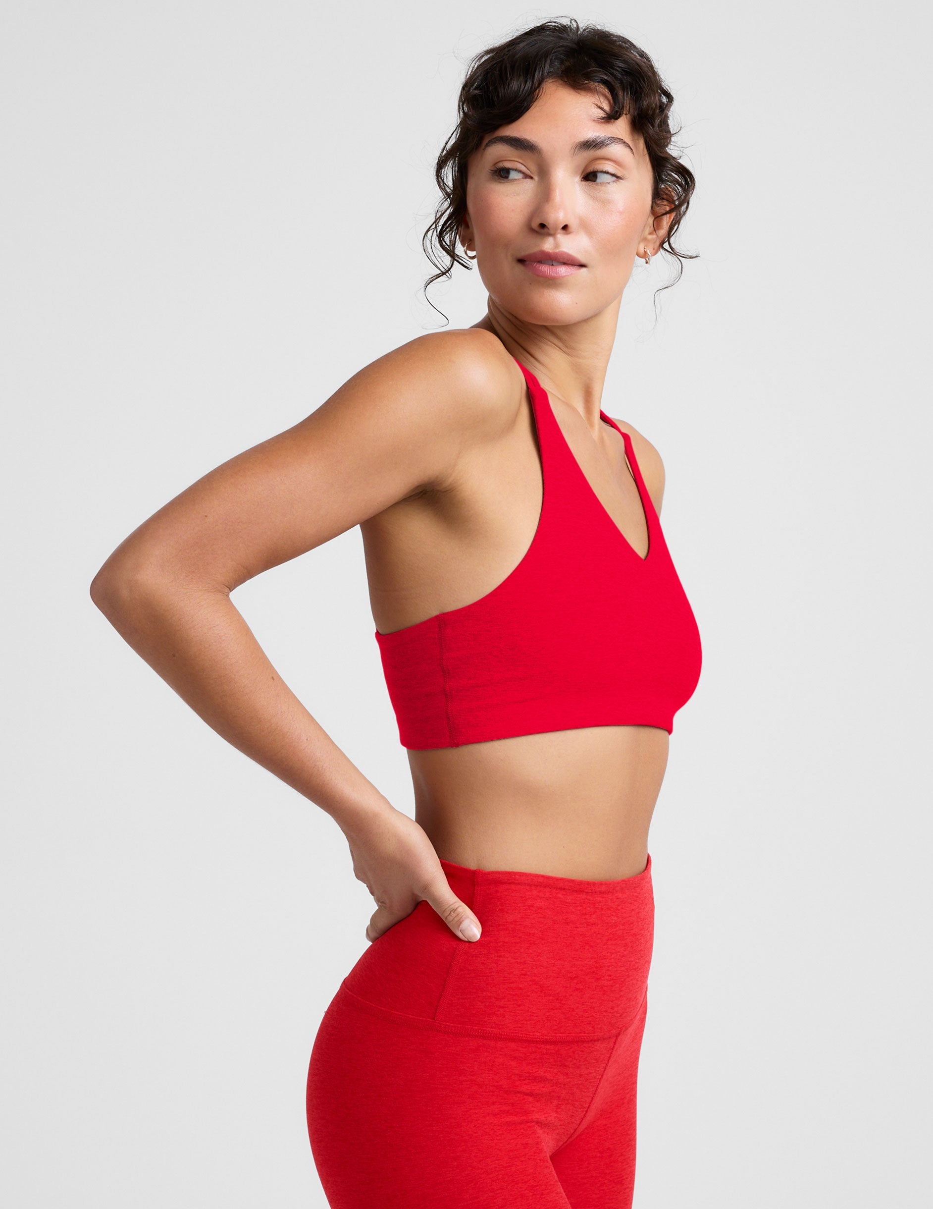 red v-neck bra top with crossover straps in the back.