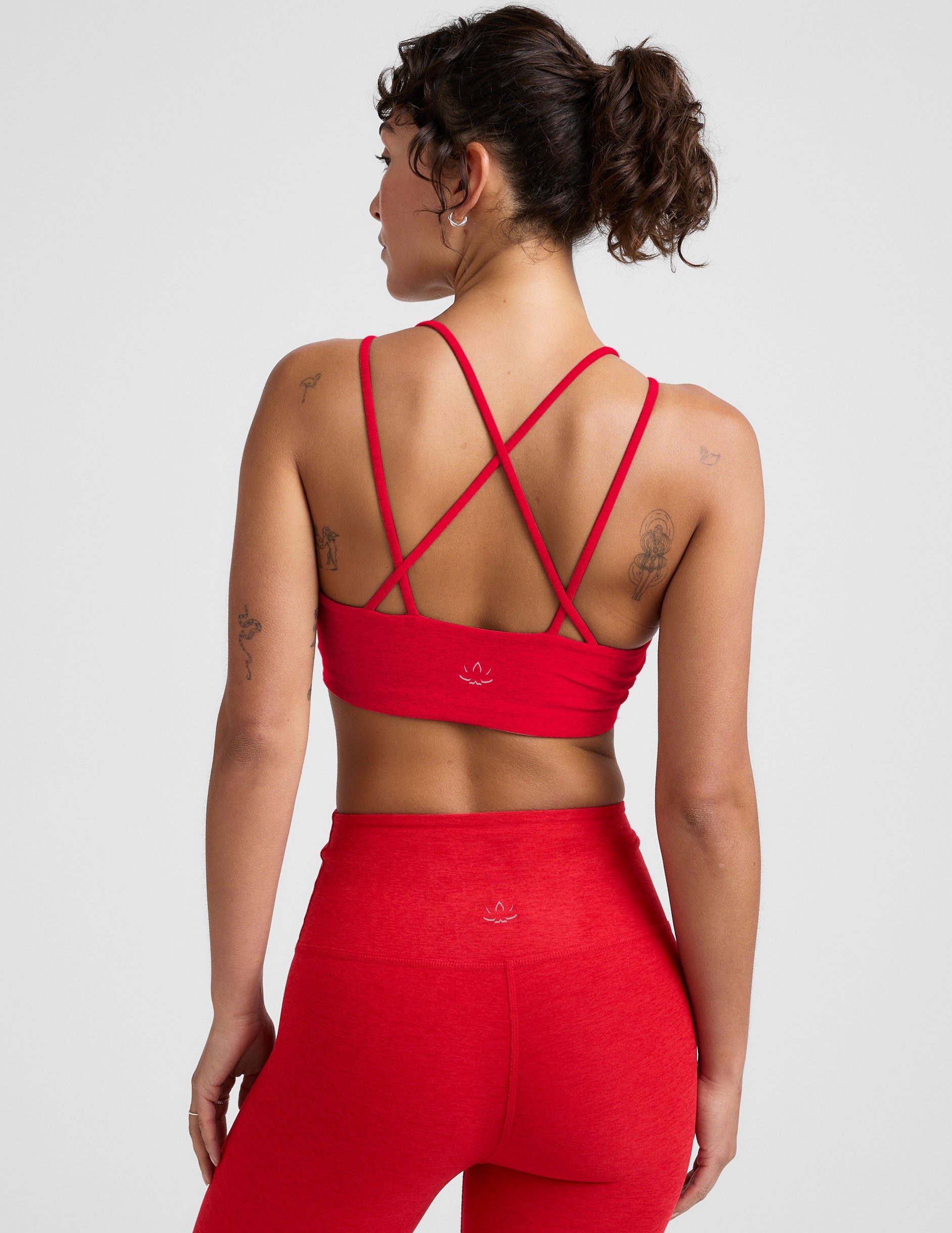 red v-neck bra top with crossover straps in the back.