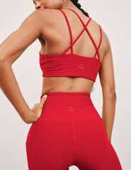 red v-neck bra top with crossover straps in the back.
