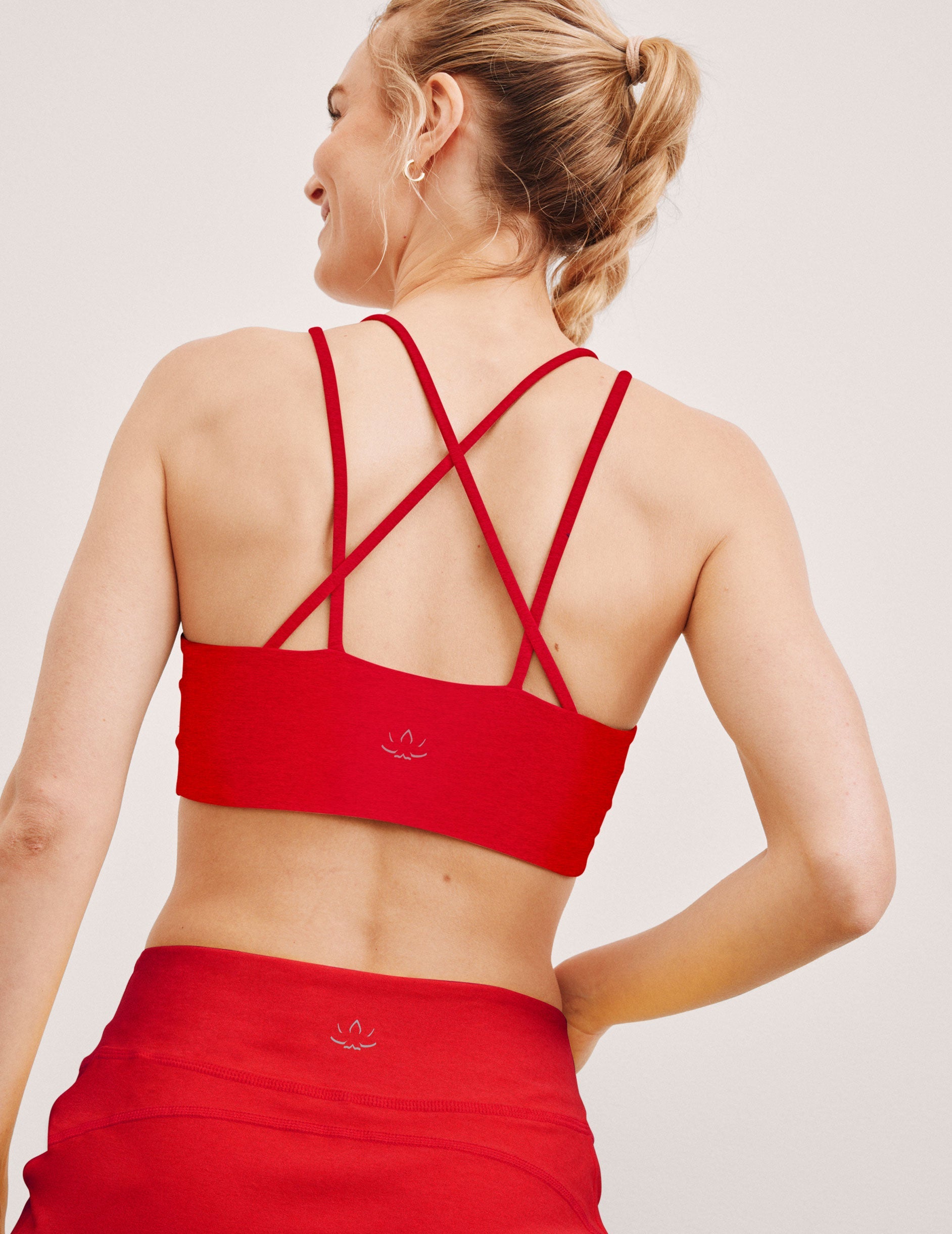 red v-neck bra top with crossover straps in the back.