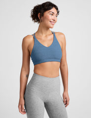 blue v-neck bra with crossover back straps.