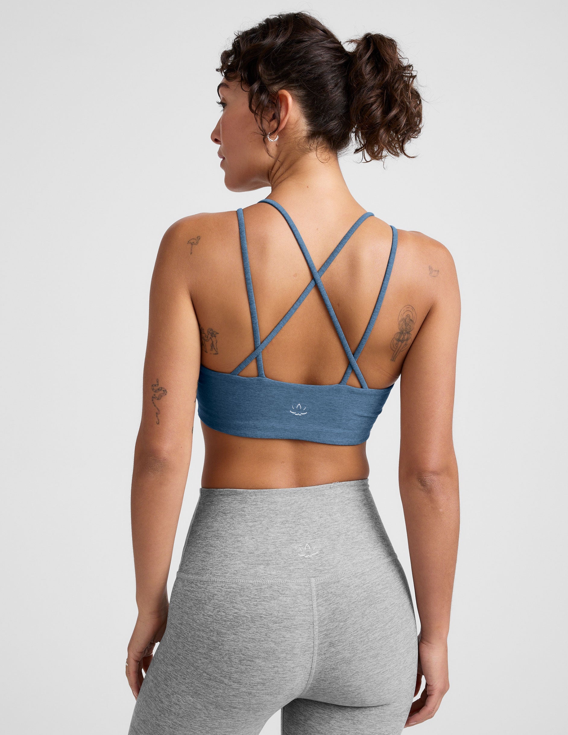 blue v-neck bra with crossover back straps.