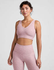 pink long line style bra with a front and back v-neck.