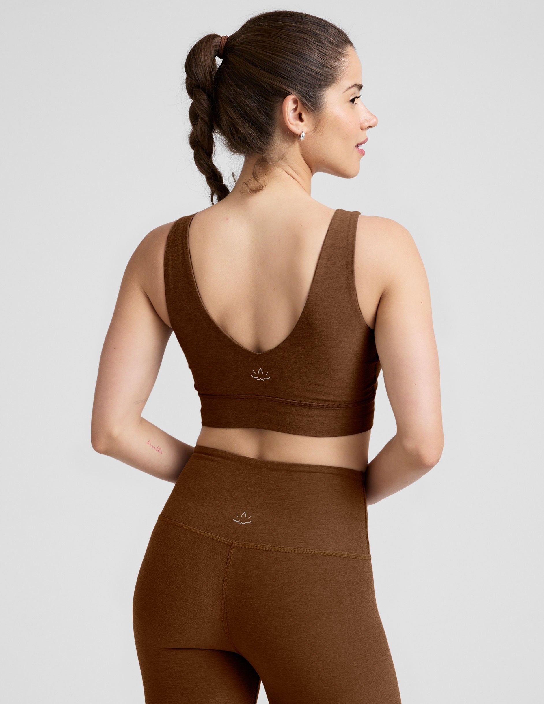 brown long line style bra with a v-neck in back and front.