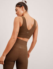 brown long line style bra with a v-neck in back and front.