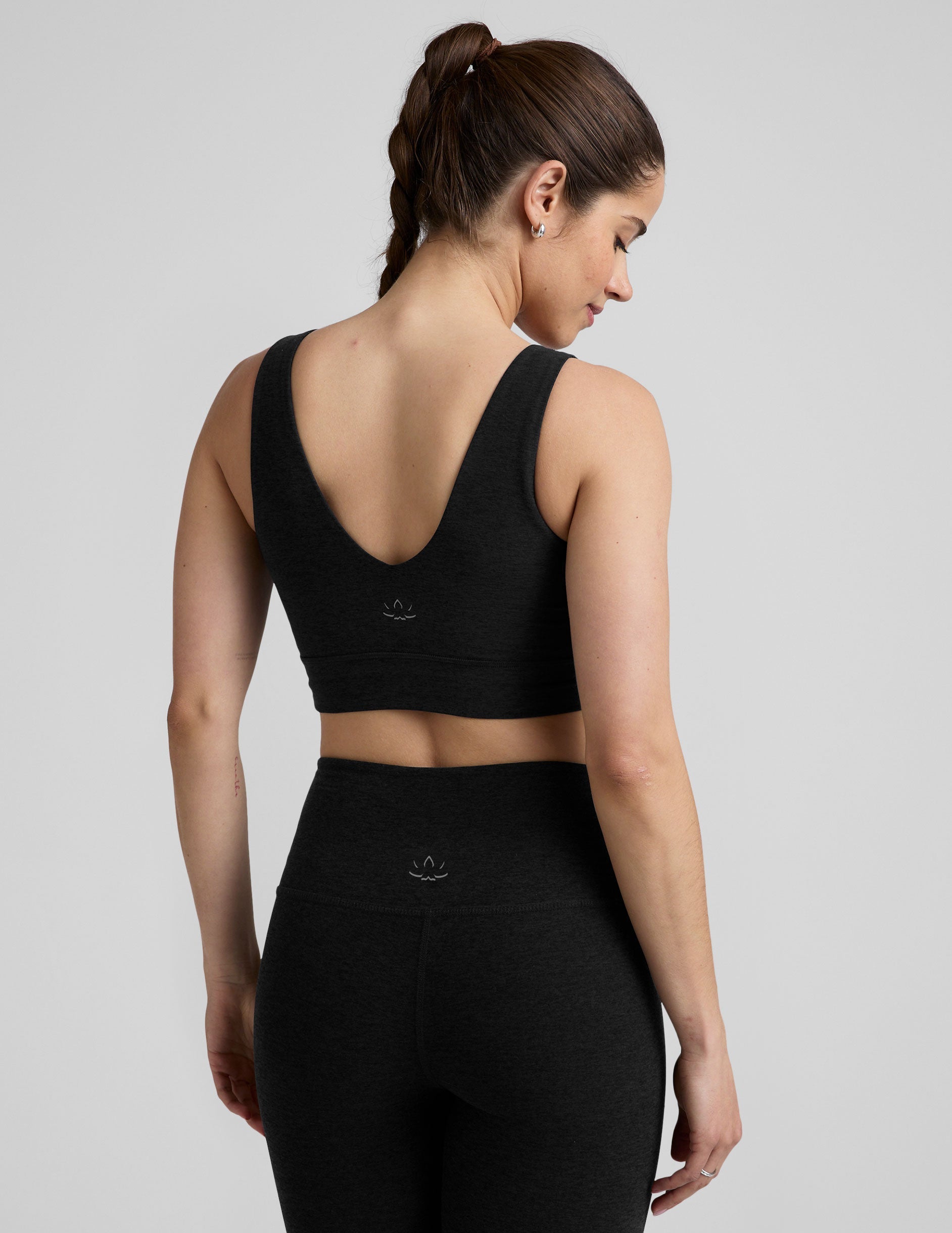 black long line style bra with a front and back v-neck.