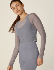 gray long sleeve mesh cropped top.
